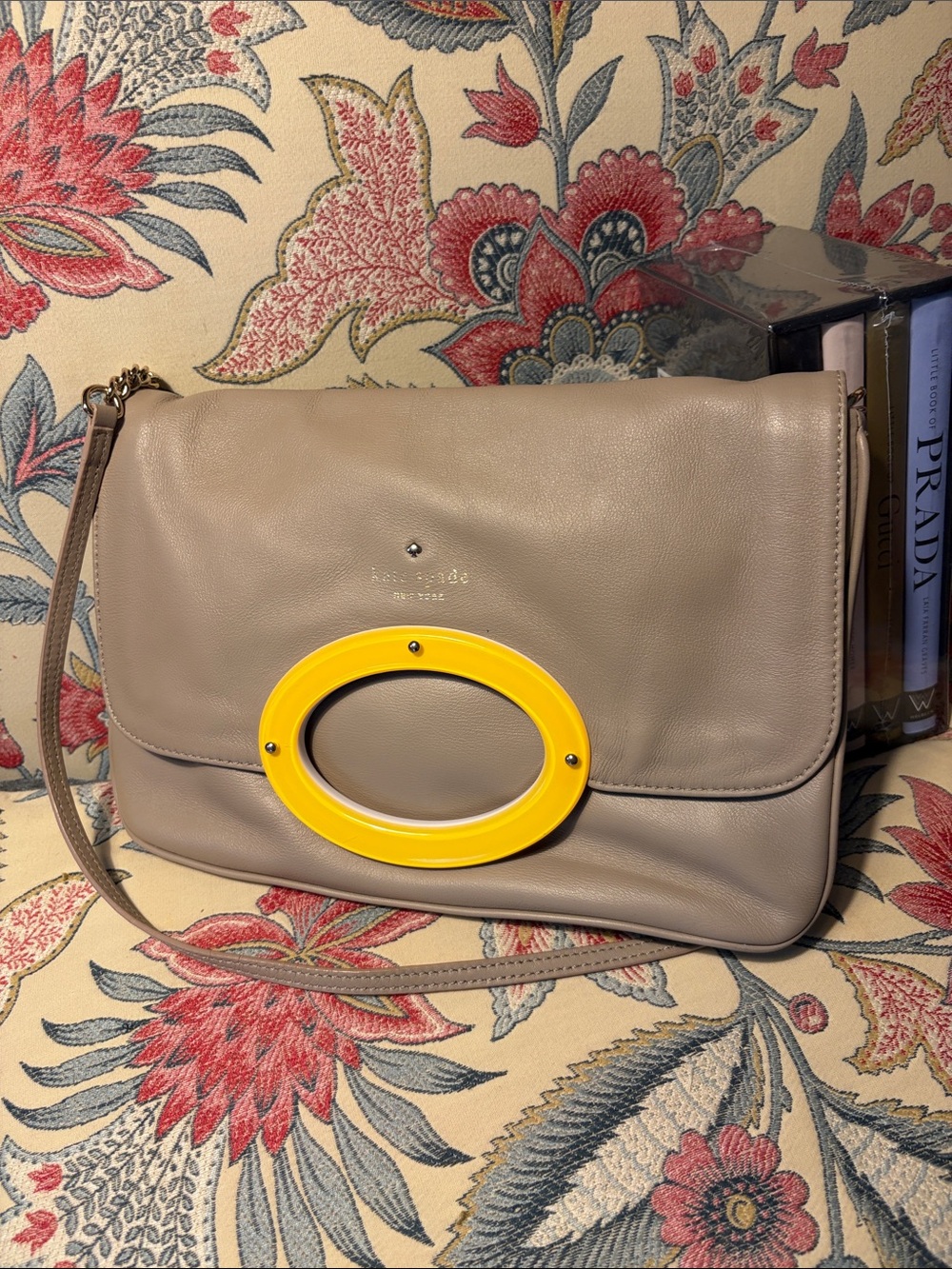 kate spade taupe leather shoulder bag with yellow oval accent